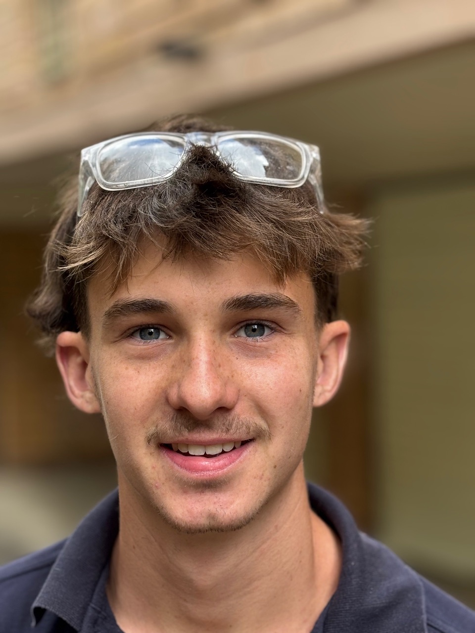 Natasha Lee carrying cleaning equipment